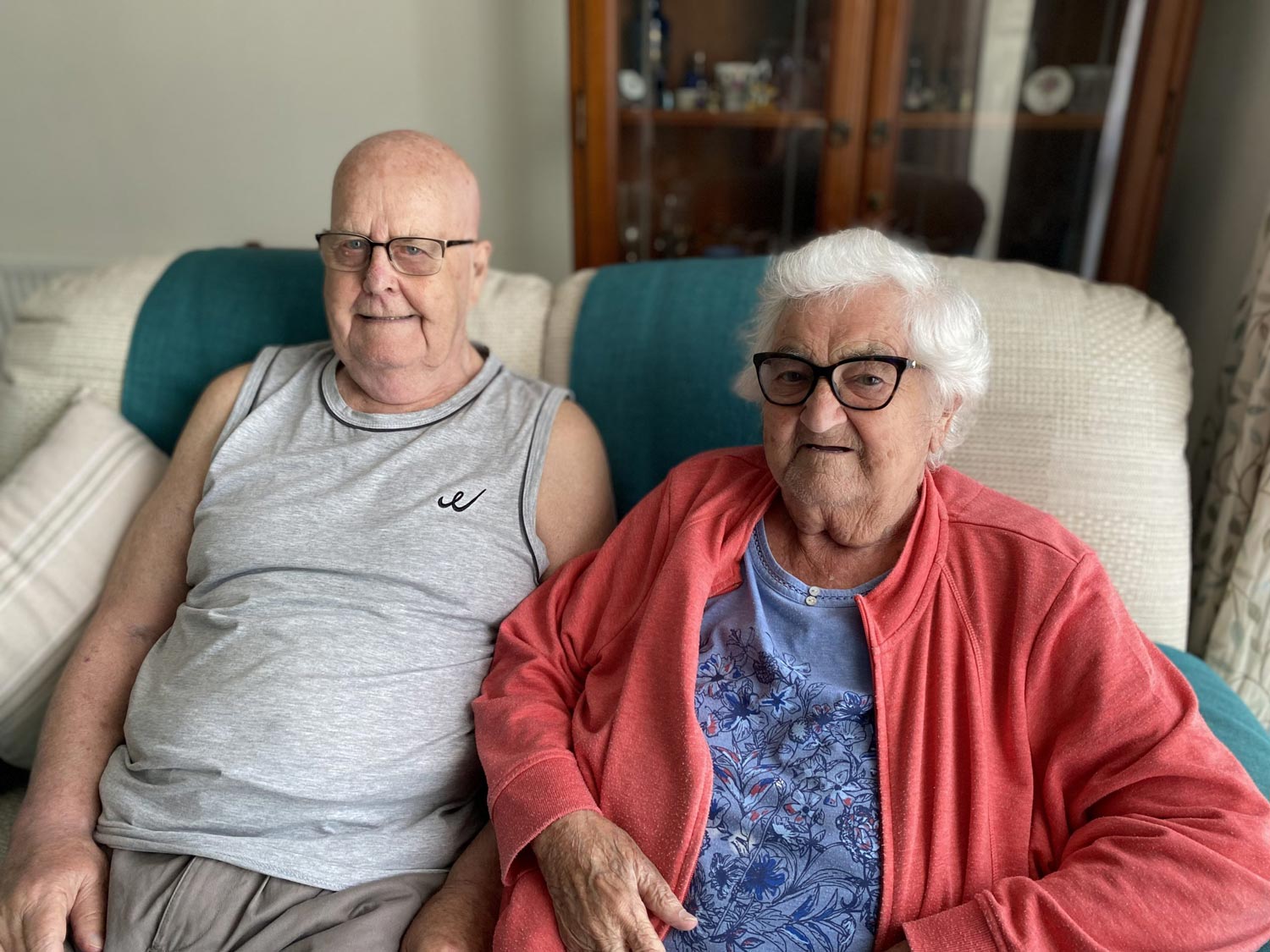 a man and woman sitting on a couch