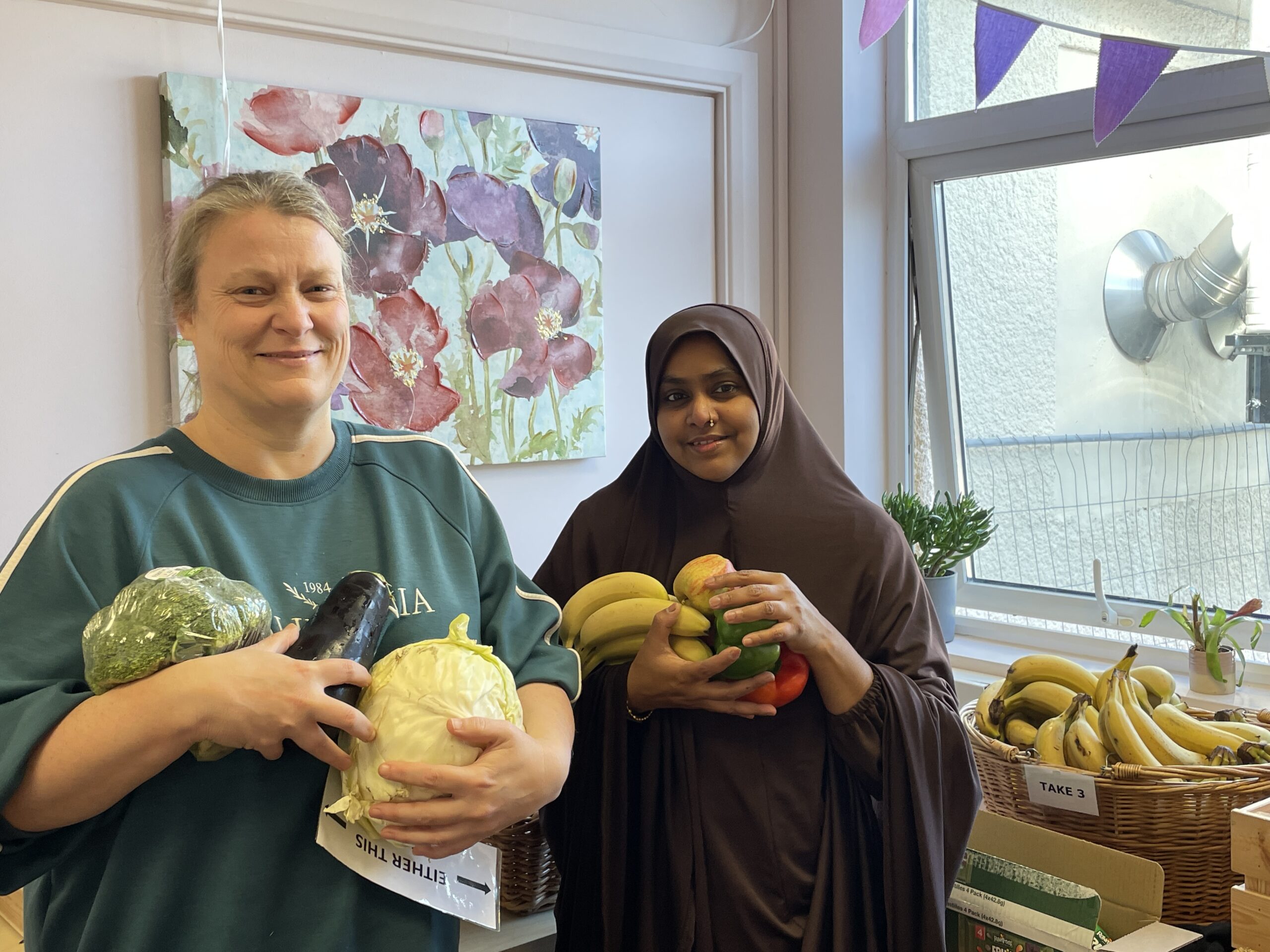 Food Club Volunteers Holding Vegetables